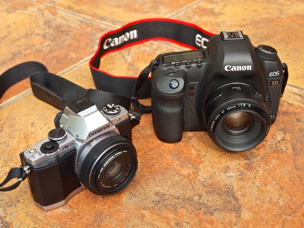 Olympus OM-D E-M5 beside a Canon 5D Mkii showing the difference in size